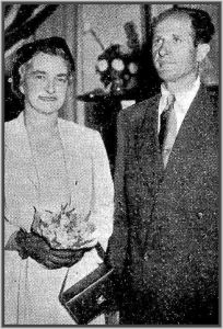 Miss I. R. Stephensen stands with her fiance, Mr. S. Fedurek, while he takes the oath. Later in the day the couple were married
